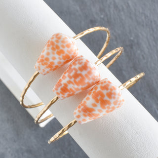 Orange Spot Cone Shell Bangle Bracelet by Yay Hawaii featuring vibrant cone shell design and orange spot details.