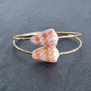 Orange Spot Cone Shell Bangle Bracelet by Yay Hawaii with vibrant shell design and smooth circular shape.