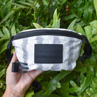 Double Pikake Lei Tyvek Fanny Pack by Yay Hawaii, showing a colorful floral fanny pack with Pikake flower design and adjustable strap.