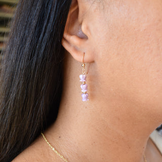 Yay Hawaii Triple Crown Flower earrings with metal accent beads, featuring vibrant floral design and dangling jewelry style.