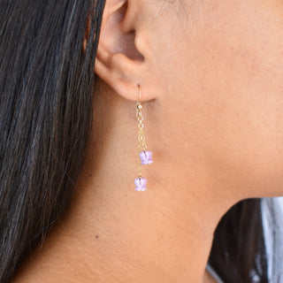 Yay Hawaii double dangle crown flower earrings with intricate floral design and gold-tone finish, hanging from ear hooks.