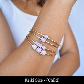 Yay Hawaii Keiki Crown Flower Bangle featuring a gold-tone finish and intricate floral design for a stylish accessory.