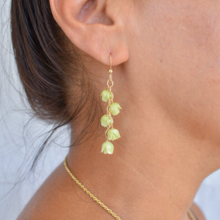 Yay Hawaii Five Cascading Pakalana Earrings featuring layered floral designs with gold accents and dangling flower motifs.