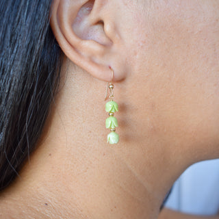 Triple Pakalana earrings by Yay Hawaii featuring metal accent beads, showcasing elegant flower-inspired jewelry.
