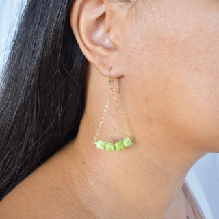 Yay Hawaii Pakalana Earrings chandelier style with intricate floral design and gold-tone finish, hanging gracefully.
