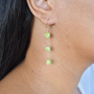 Dangling three-chain link Pakalana earrings by Yay Hawaii featuring intricate flower and leaf designs in silver tones.