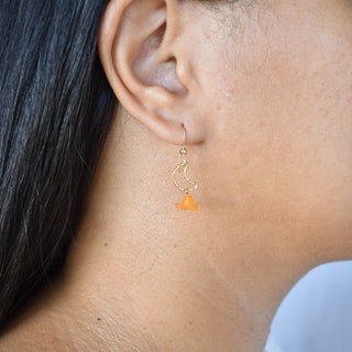 Crescent moon Puakenikeni earrings by Yay Hawaii featuring gold-tone crescent shapes and floral-inspired design.