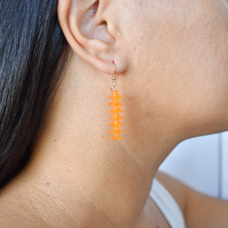 Longer Seven Cluster Puakenikeni earrings by Yay Hawaii featuring intricate floral designs and dangling charms.