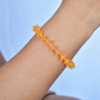Puakenikeni linked bracelet with extender chain from Yay Hawaii showcasing floral design and gold-tone finish.