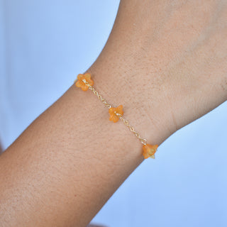 Yay Hawaii Puakenikeni Chain Link Station Bracelet showcasing a delicate floral design in gold tone on a white background.