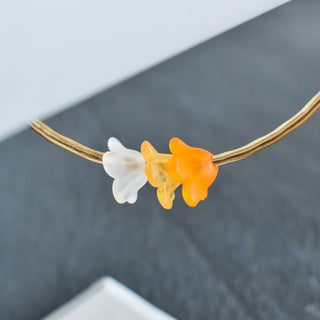 Yay Hawaii Shaded Trio Puakenikeni Bangle with colorful, layered design and floral accents, featuring traditional Hawaiian style jewelry.