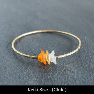 Yay Hawaii Keiki Ombre Trio Puakenikeni Bangle with colorful gradient design and floral accents on a white background.