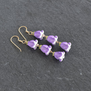 Realistic Pua Kalaunu triple linked earrings by Yay Hawaii featuring intricate floral and geometric silver designs.