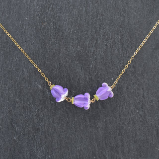 Realistic Pua Kalaunu triple linked necklace by Yay Hawaii featuring traditional Hawaiian floral design and gold-tone links.