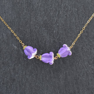 Realistic Pua Kalaunu triple linked necklace by Yay Hawaii featuring intricate floral and Polynesian-inspired metal links.