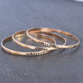 Hawaiian Heirloom Style Patterned Inoa Bangle by Yay Hawaii, featuring vibrant traditional Polynesian designs on a polished bracelet.