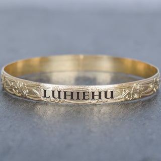 Hawaiian Heirloom Style Patterned Inoa Bangle by Yay Hawaii, showcasing intricate floral and geometric designs in vibrant colors.