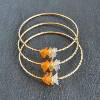 Yay Hawaii Keiki Ombre Trio Puakenikeni Bangle with colorful ombre design and floral accents on a bracelet.