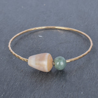 Tan cone shell bangle bracelet by Yay Hawaii featuring a smooth shell design and open cuff style.