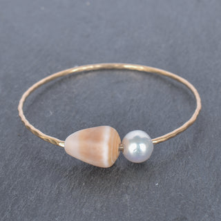 Tan cone shell bangle by Yay Hawaii featuring a smooth, rounded shell design perfect for beach-inspired jewelry.