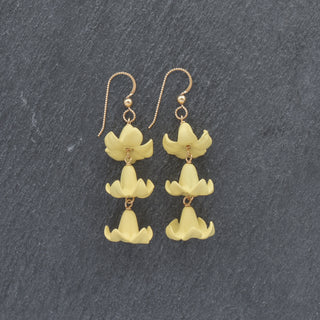 Triple linked Big Puakenikeni earrings by Yay Hawaii featuring vibrant floral design and bold gold-tone hoops.