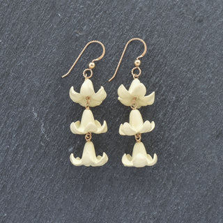 Yay Hawaii triple linked Big Puakenikeni earrings in vibrant colors, showcasing bold floral jewelry on a white background.
