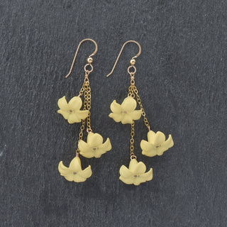 Yay Hawaii triple dangle Puakenikeni earrings in vibrant colors, featuring layered floral design and gold accents.