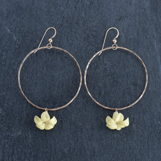 Large gold hoop earrings with dangling big Puakenikeni flowers by Yay Hawaii, showcasing vibrant floral jewelry design.