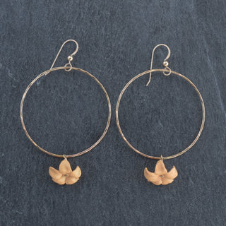 Large Yay Hawaii hoop earrings with dangling big Puakenikeni flowers in various colors, stylish and tropical-inspired jewelry.