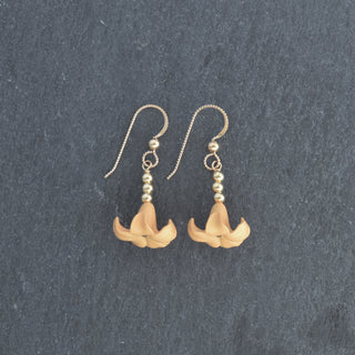 Drop Big Puakenikeni earrings by Yay Hawaii featuring colorful accent beads, showcased in a vibrant, tropical-inspired design.