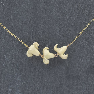 Linked Triple Big Puakenikeni Necklace by Yay Hawaii featuring vibrant, colorful Hawaiian flower pendants on a necklace.