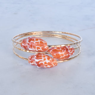 Yay Hawaii Miter Shell Bangle Bracelet featuring a sleek, polished shell design on a stylish metallic band.