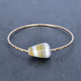 Yellow cone shell bangle by Yay Hawaii featuring a vibrant, handcrafted shell design for beach-inspired jewelry.