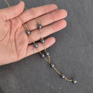 Yay Hawaii Lariat Y necklace with 8mm black freshwater pearls, showcasing elegant jewelry design and smooth pearl beads