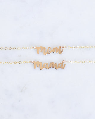 Mini Mom & Mama necklaces by Yay Hawaii featuring delicate gold chains and small pendant charms on a neutral background.