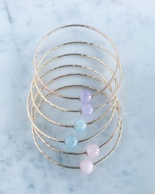 Yay Hawaii gemstone bangle featuring rose quartz, aquamarine, and lavender amethyst beads on a stretchy band.