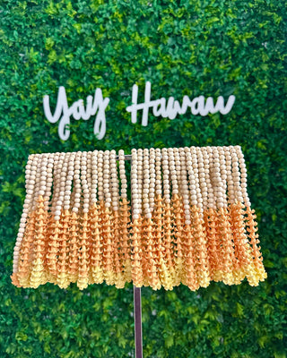 Yellow Puakenikeni flower car lei from Yay Hawaii, showcasing fresh, vibrant blossoms arranged in a traditional Hawaiian style.