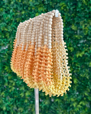 Yellow Puakenikeni flower car lei from Yay Hawaii, featuring fresh, fragrant blossoms arranged as a decorative necklace for vehicles.