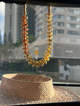Puakenikeni flower car lei by Yay Hawaii, handcrafted yellow floral necklace for cars or celebrations.