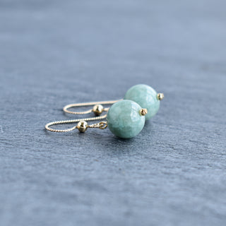 Yay Hawaii single jade drop earrings in 10mm or 8mm size, featuring smooth green jade teardrop design on gold hooks