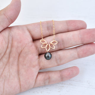 Small Naupaka necklace from Yay Hawaii featuring a delicate floral pendant on a thin cord.