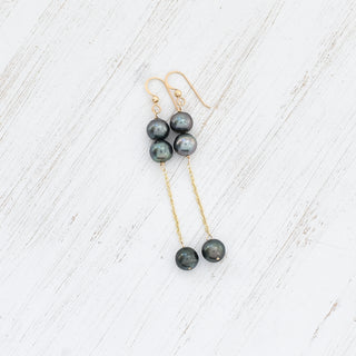 Double dangle Tahitian pearl earrings by Yay Hawaii featuring shiny black pearls and elegant silver hooks.