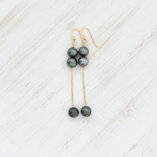 Double dangle Tahitian pearl earrings by Yay Hawaii featuring sleek silver hooks and lustrous black pearls.