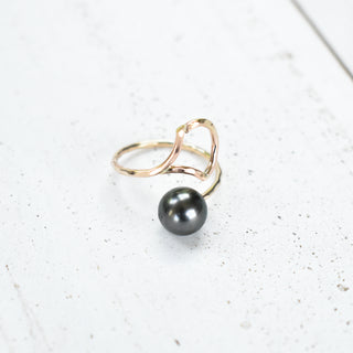 Yay Hawaii Ipu Ring featuring a carved green stone with intricate Hawaiian design, set in a silver band.