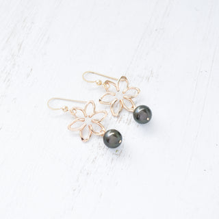 Small Na'u flower earrings by Yay Hawaii featuring 8mm black freshwater pearls and intricate flower design.
