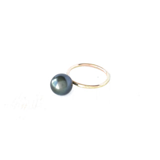 Tahitian pearl Kahi stacking ring by Yay Hawaii featuring a lustrous black pearl set in a delicate gold band.