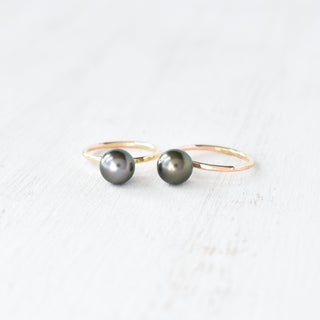 Tahitian pearl Kahi stacking ring by Yay Hawaii with a sleek gold band and a prominent black pearl setting.