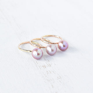 Purple Edison Kahi stacking ring by Yay Hawaii, featuring layered purple resin and gold accents, displayed on a neutral background.