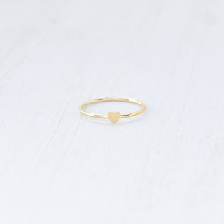 Tiny Heart stacking ring by Yay Hawaii, featuring a delicate gold band with a small heart charm, designed for everyday wear.