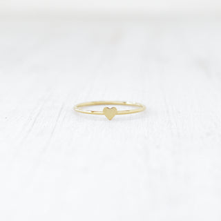 Tiny Heart stacking ring from Yay Hawaii showing a delicate gold band with a small heart charm.